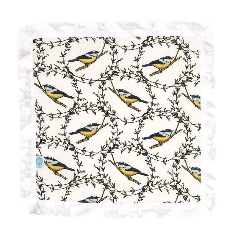 Patterned fabric with birds and branches on a white background