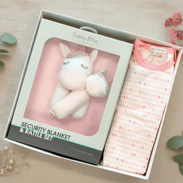 Pretty baby gift box with baby clothes and toys.