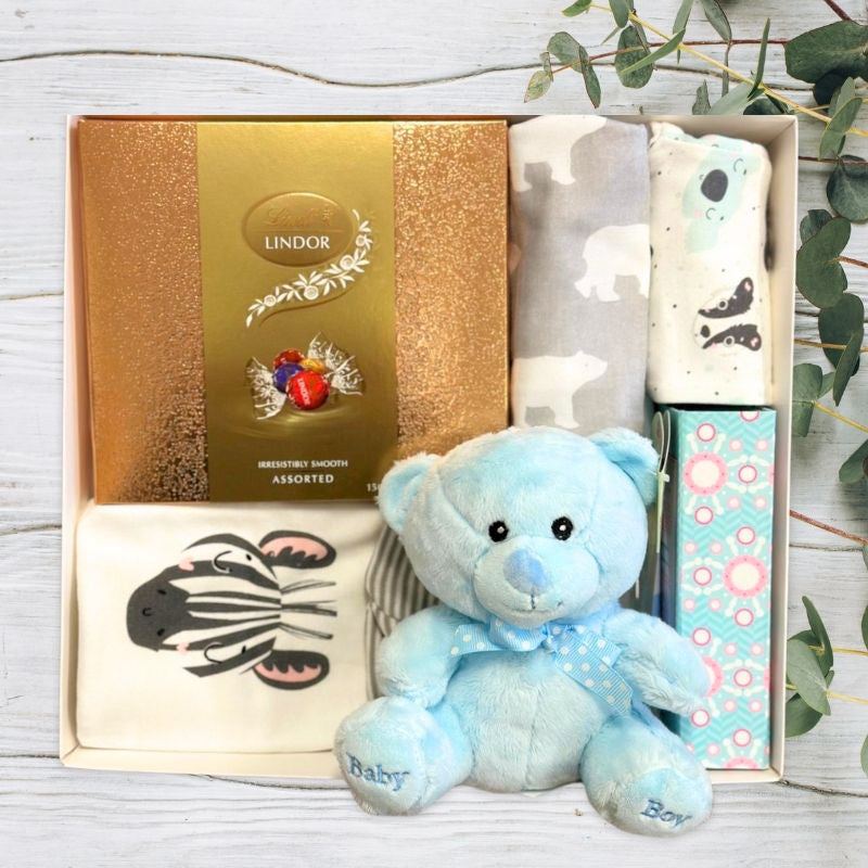 baby gift set with blue bear and baby clothing