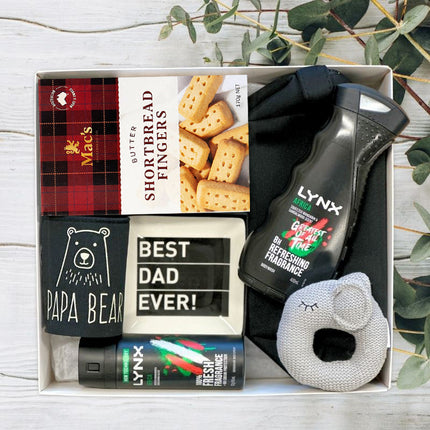 New Dad Gift set with Lynx products, a rattle toy, and a box of shortbread fingers from The Baby Gift Company.