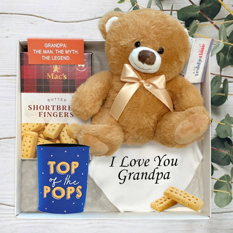 Gift set with teddy bear, crackers, and 'Papa Bear' mug in a box.
