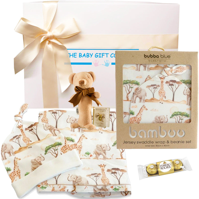 Baby gift set with swaddle wrap, teddy bear, and Lindt chocolate bar.