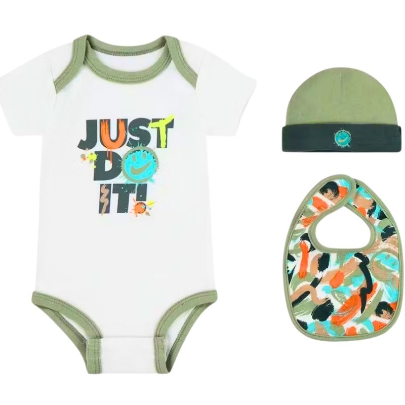 Nike Baby outfit set with onesie, hat, and bib on a white background