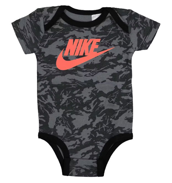 Camouflage-patterned baby onesie with Nike logo on a white background