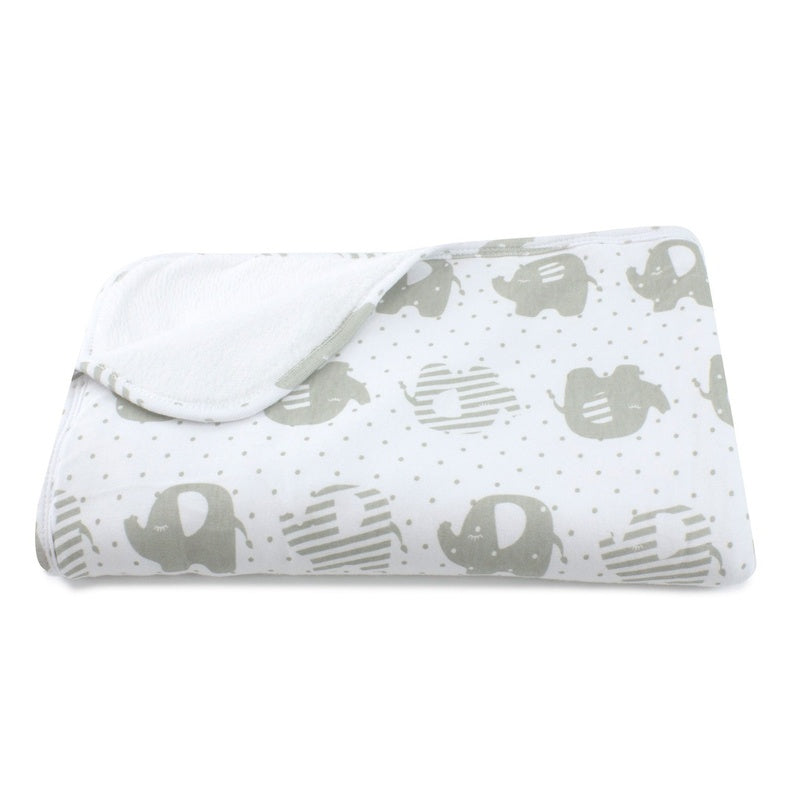 Folded blanket with elephant pattern on a white background
