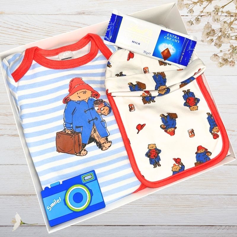 paddington bear gift box with baby clothing and lindt chocolate