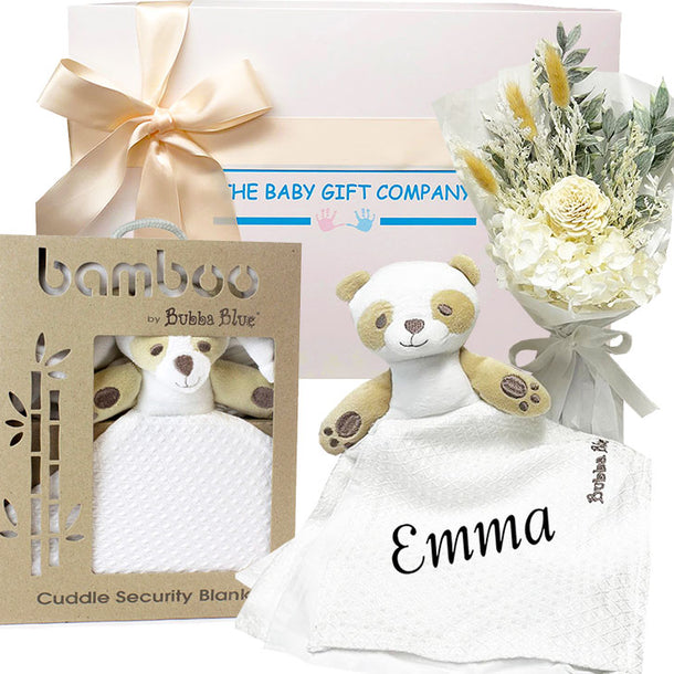 Baby gift set with security blanket, teddy bear, and flowers from The Baby Gift Company.