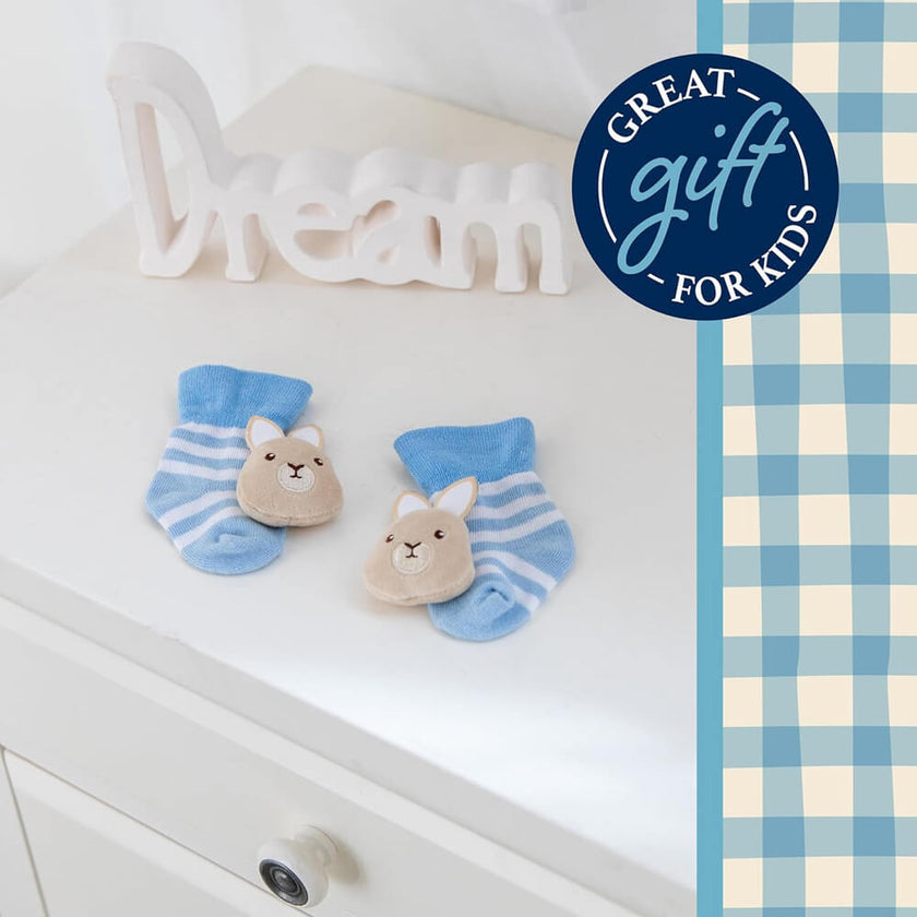 Peter Rabbit Ultra-Soft Baby Foot Rattles on a table background