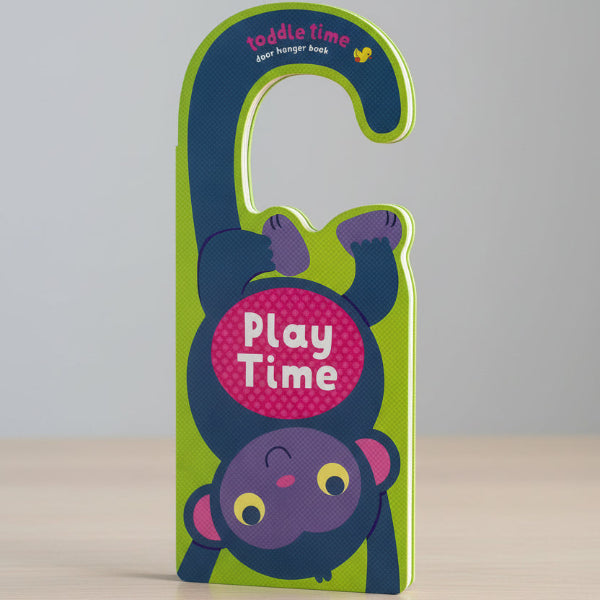 Children's book with a monkey design and 'Play Time' text on a green background