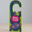 Children's book with a monkey design and 'Play Time' text on a green background