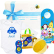 Baby gift set with onesie, toys, and door hanger from The Baby Gift Company.