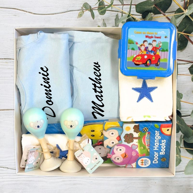 baby gift set with clothes and toys in box