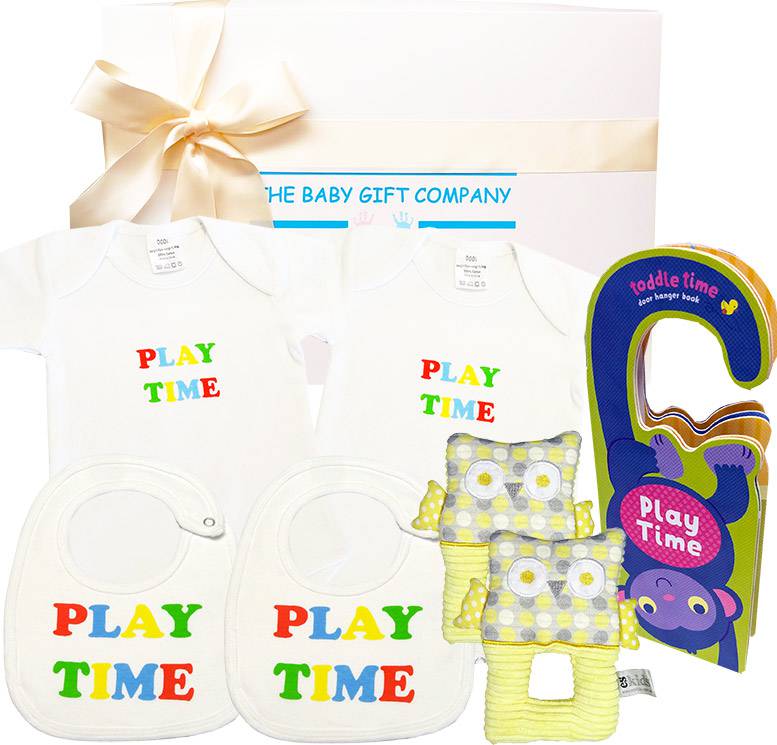 Baby gift set with bibs, rattle, and toy from The Baby Gift Company.