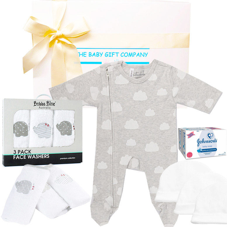 Baby gift set with gray onesie, face washers, and Johnson's products on a white background.