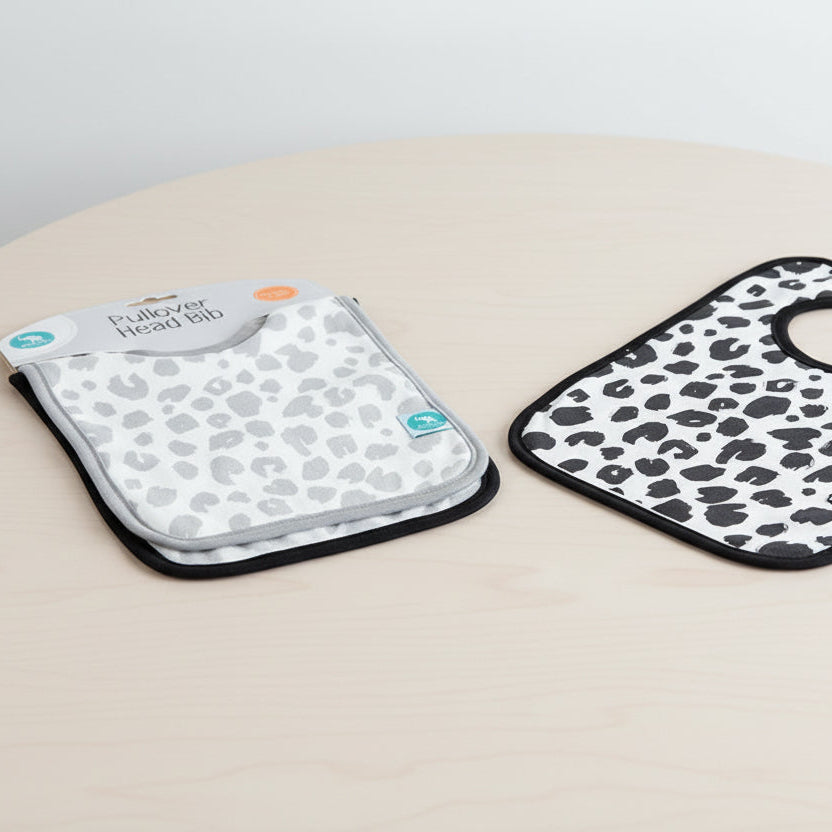 Leopard print pullover head bib with packaging on a white background