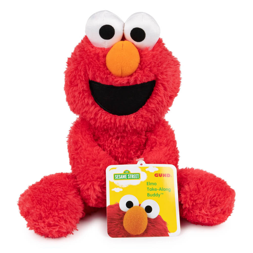 Red elmo plush toy with a smiling face on a white surface