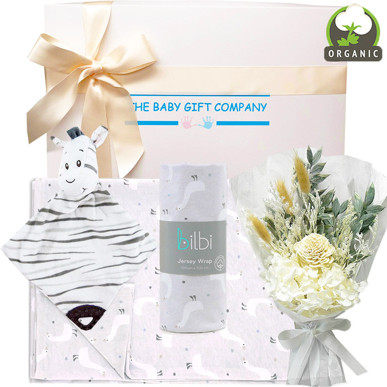 baby gift box with zebra toy, flowers and blanket