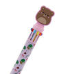 Multicolored pen with bear-shaped cap on a white background