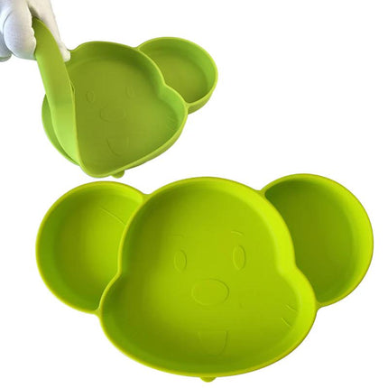 Green silicone bowl shaped like a bear with a white background