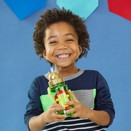 Child holding a colorful Skip Hop Zoo Straw Bottle against a blue background with geometric shapes