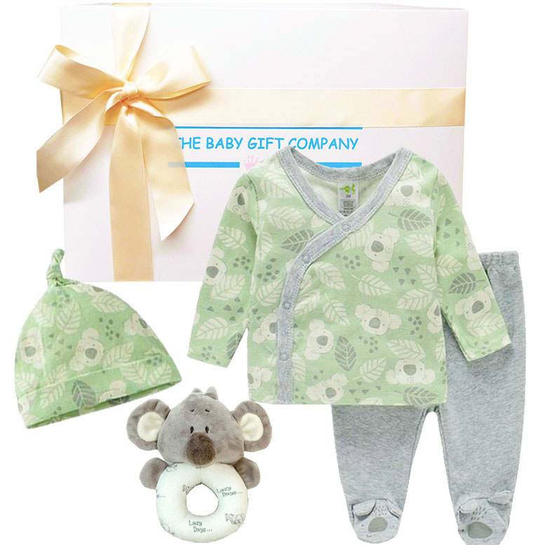 Baby gift set with green and gray outfit, hat, and toy from The Baby Gift Company.