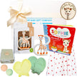 Collection of baby products including a giraffe-themed book, teether, and bath toys with 'Sophie la girafe' branding.