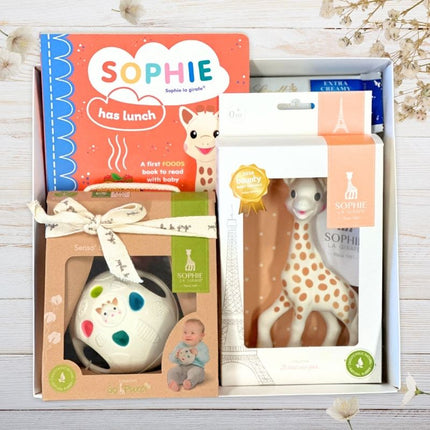 Sophie the Giraffe baby gift set with book and rattle on a white background
