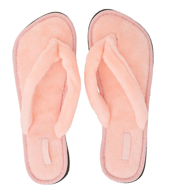Pair of pink slippers on a white background