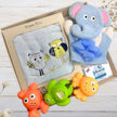 Baby bath toy set with elephant bath towel, soft toy, and three colorful bath toys in a box.