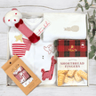 Baby gift set with toys, clothes, and a box of shortbread fingers from The Baby Gift Company