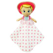Toy doll with pink polka dot blanket on a white background