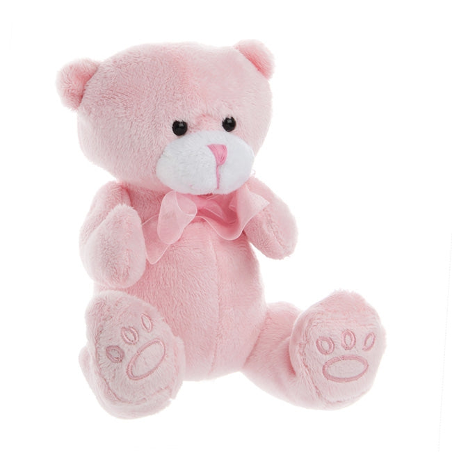 Pink teddy bear with a bow tie on a white background