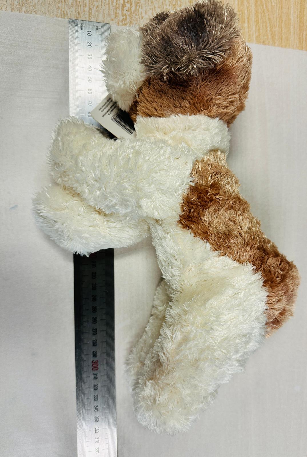 Dog Soft Toy being measured on table