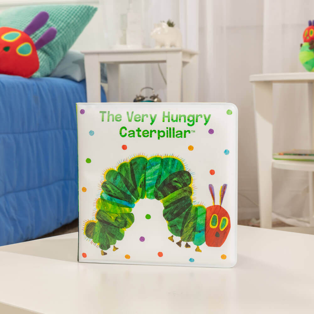 Waterproof baby bath book featuring The Very Hungry Caterpillar on a table surface