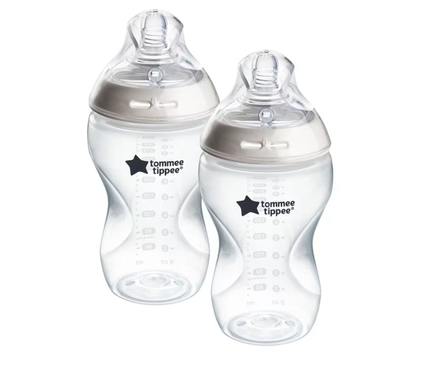 Two Tommee Tippee baby bottles on a white background