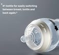 Baby bottle with text on a gray background