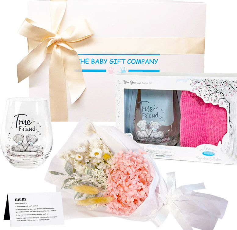 Baby gift set with glass, flowers, and other items from The Baby Gift Company.