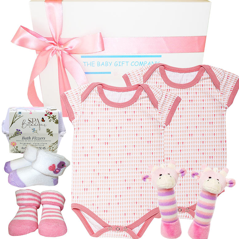 Baby gift set with pink and white checkered onesie, socks, and toys from The Baby Gift Company.