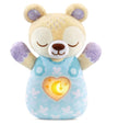 Plush toy bear with a heart-shaped light on a white background