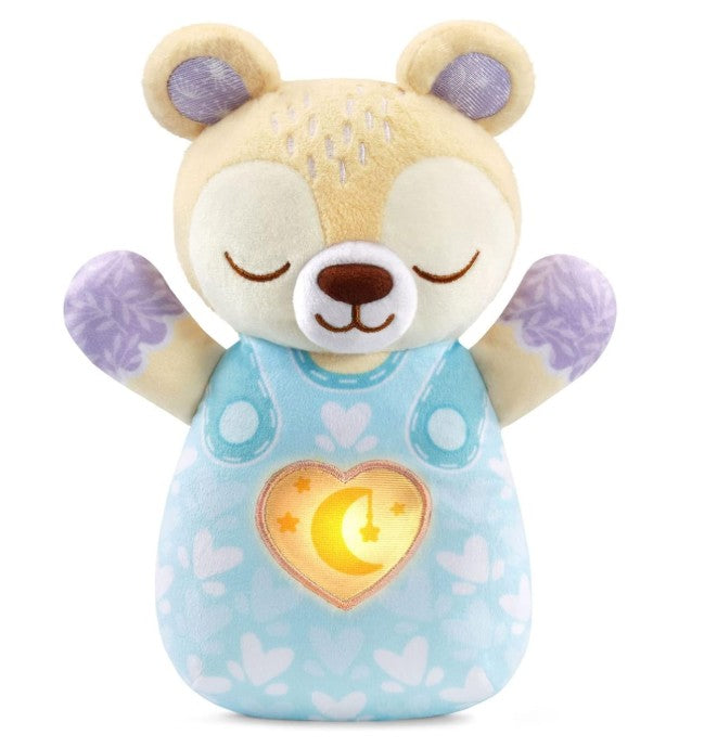 Plush toy bear with a heart-shaped light on a white background