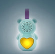 Toy with a heart-shaped light and speaker on a gray background