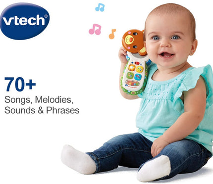 Baby holding a VTech toy with text about features on a white background