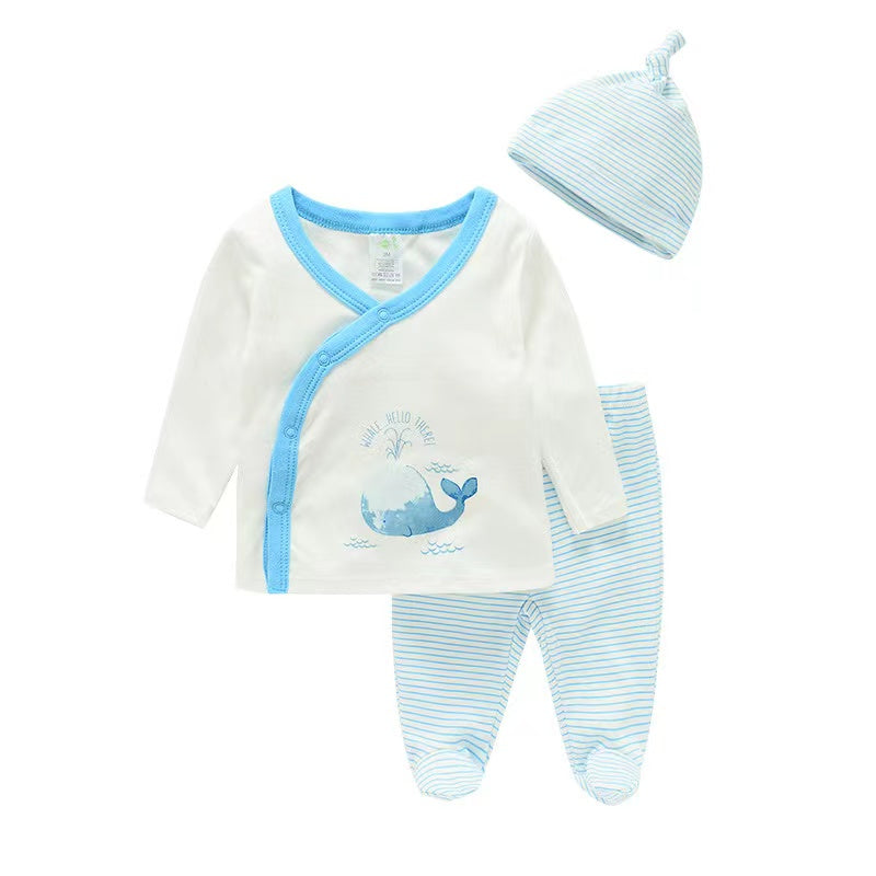 Baby outfit set with onesie, pants, and hat featuring a whale design on a white background.