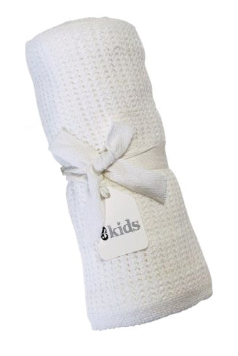 White textured baby blanket with a visible brand label on a white background