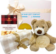 Baby gift set with teddy bear, blanket, and shortbread fingers from The Baby Gift Company.