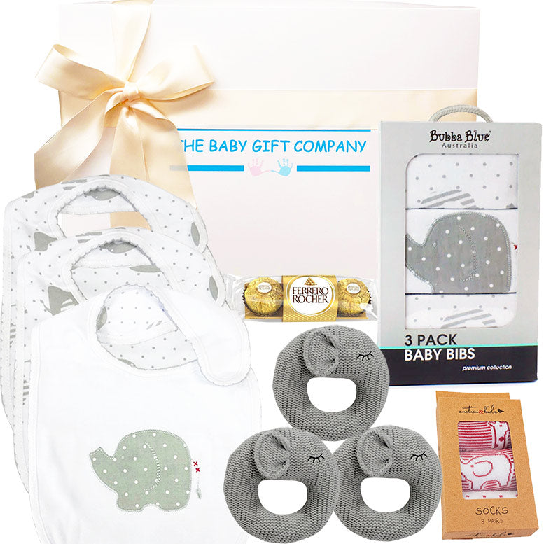 Baby gift set with grey elephant bibs, socks, and chocolate, branded 'The Baby Gift Company'.