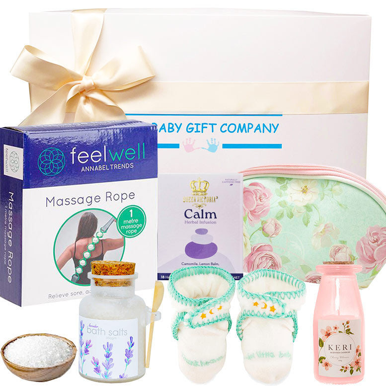 Baby gift set with massage rope, bath salts, and other items from Annabel Trends.