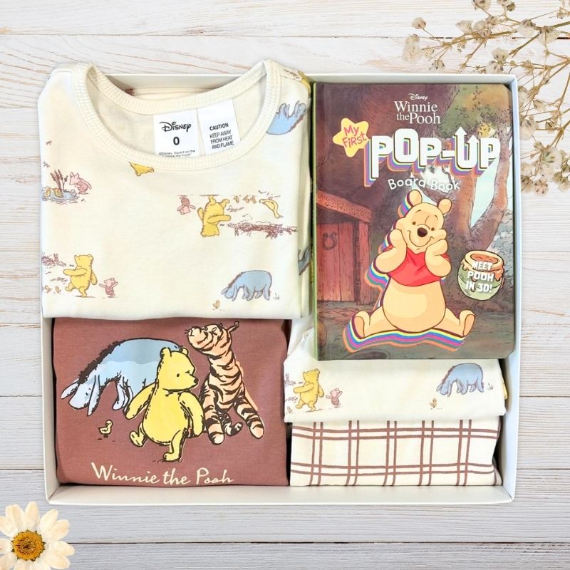 Baby gift set with Winnie the Pooh Organic Baby clothing and a pop uo book from Disney