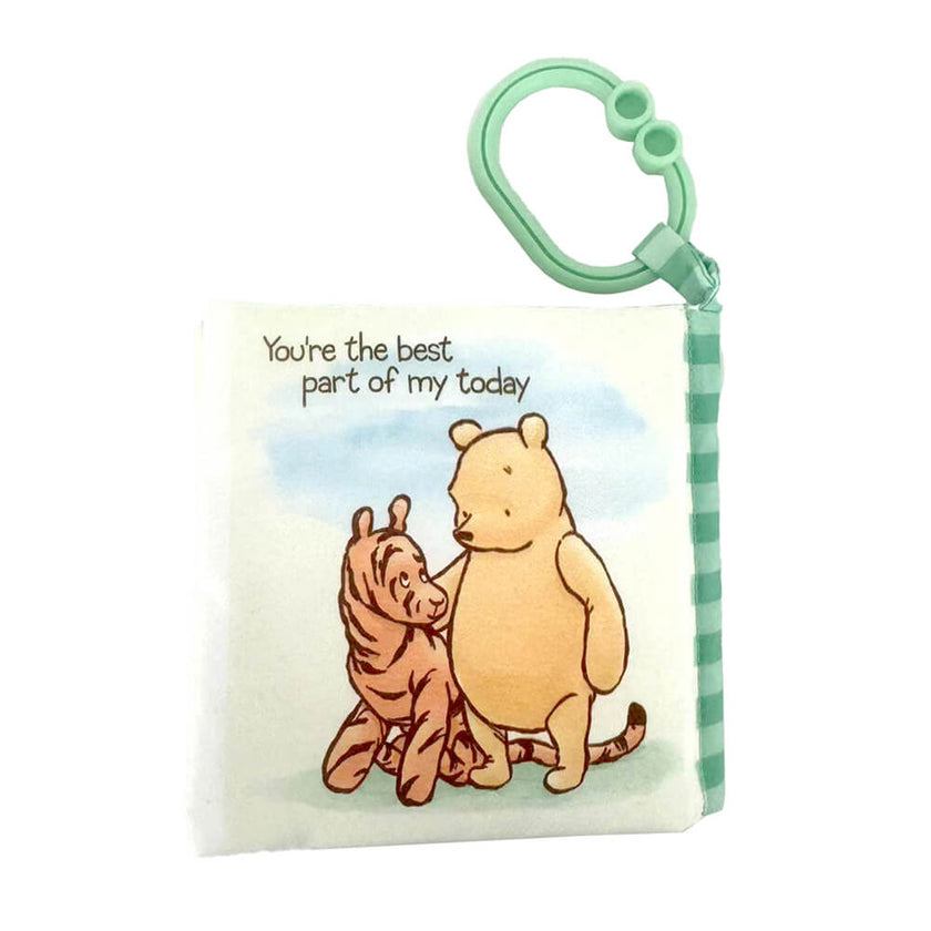 Clip-on Winnie the Pooh pram activity toy book on a white background