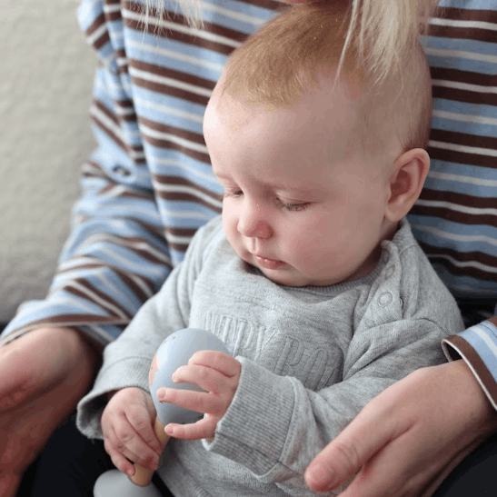 Mother and Baby holding Wooden Maracas